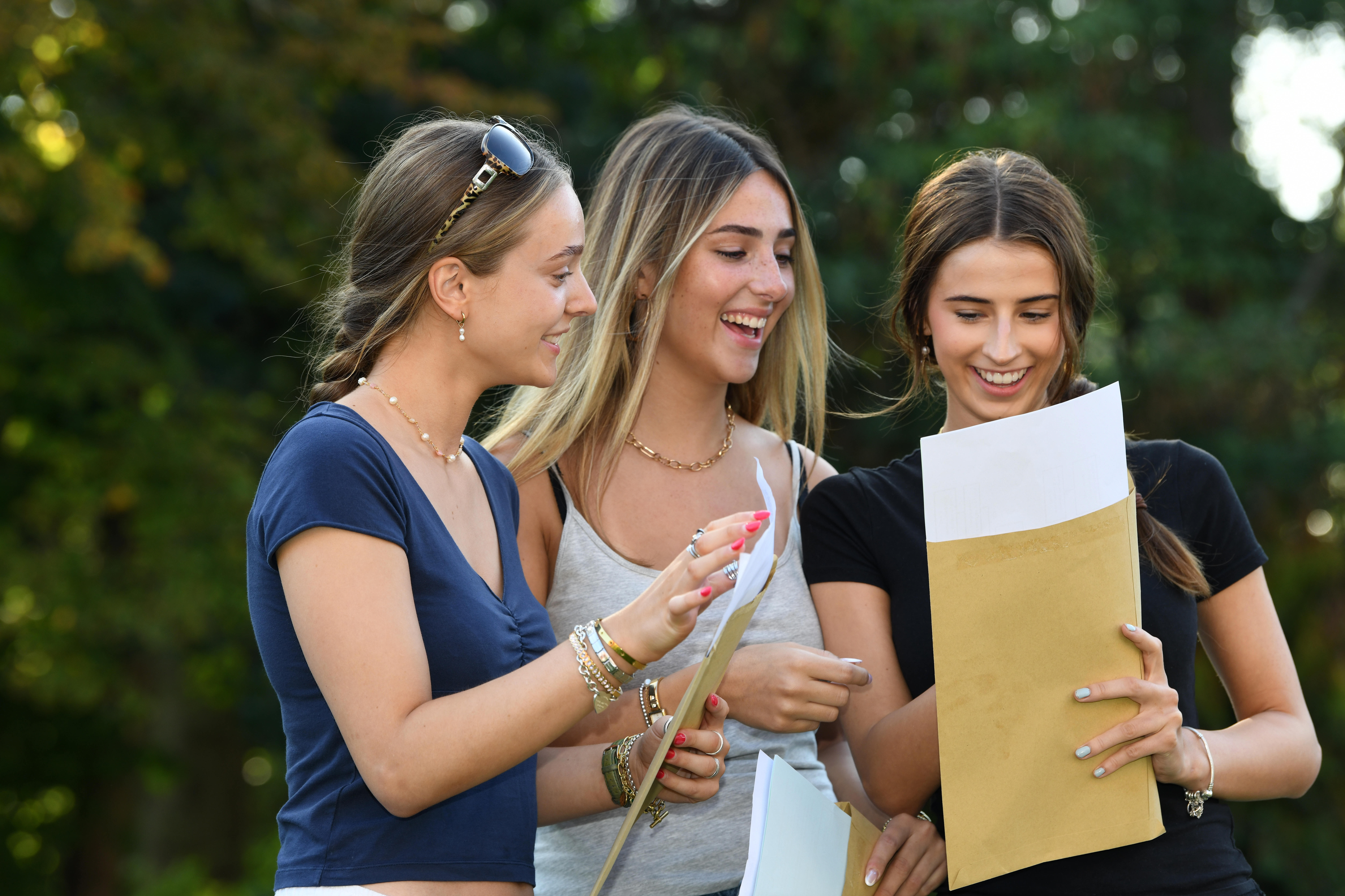 Three girls collecting their A Level results