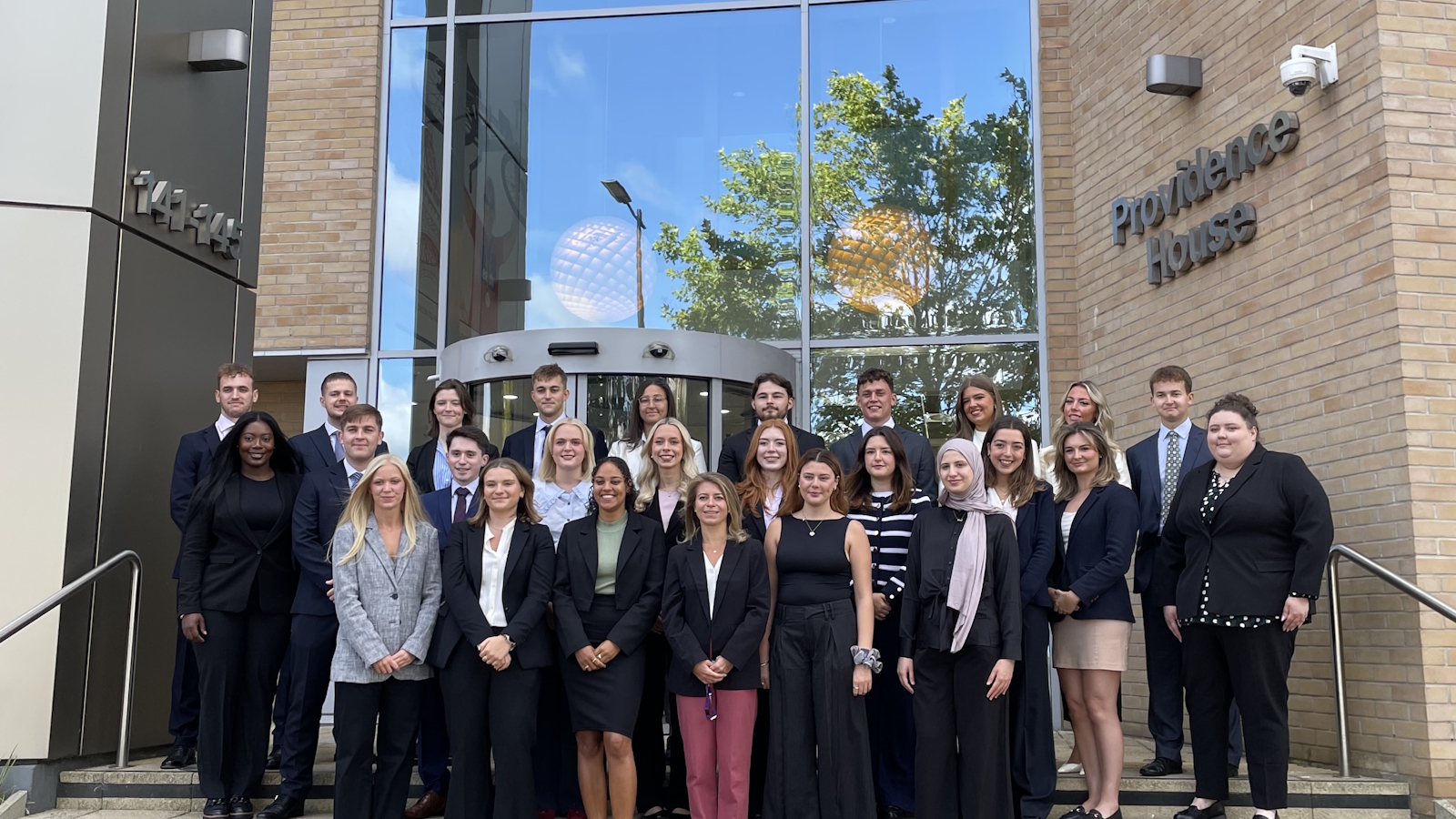 Group of people stood outside Birketts office building