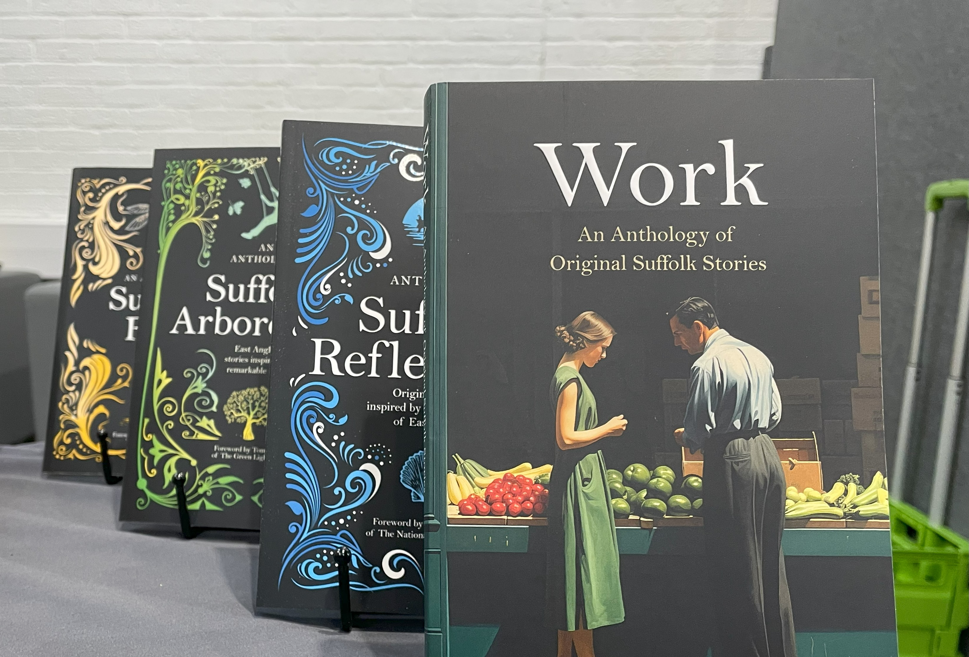 The new volume, Work, with previous books written by students