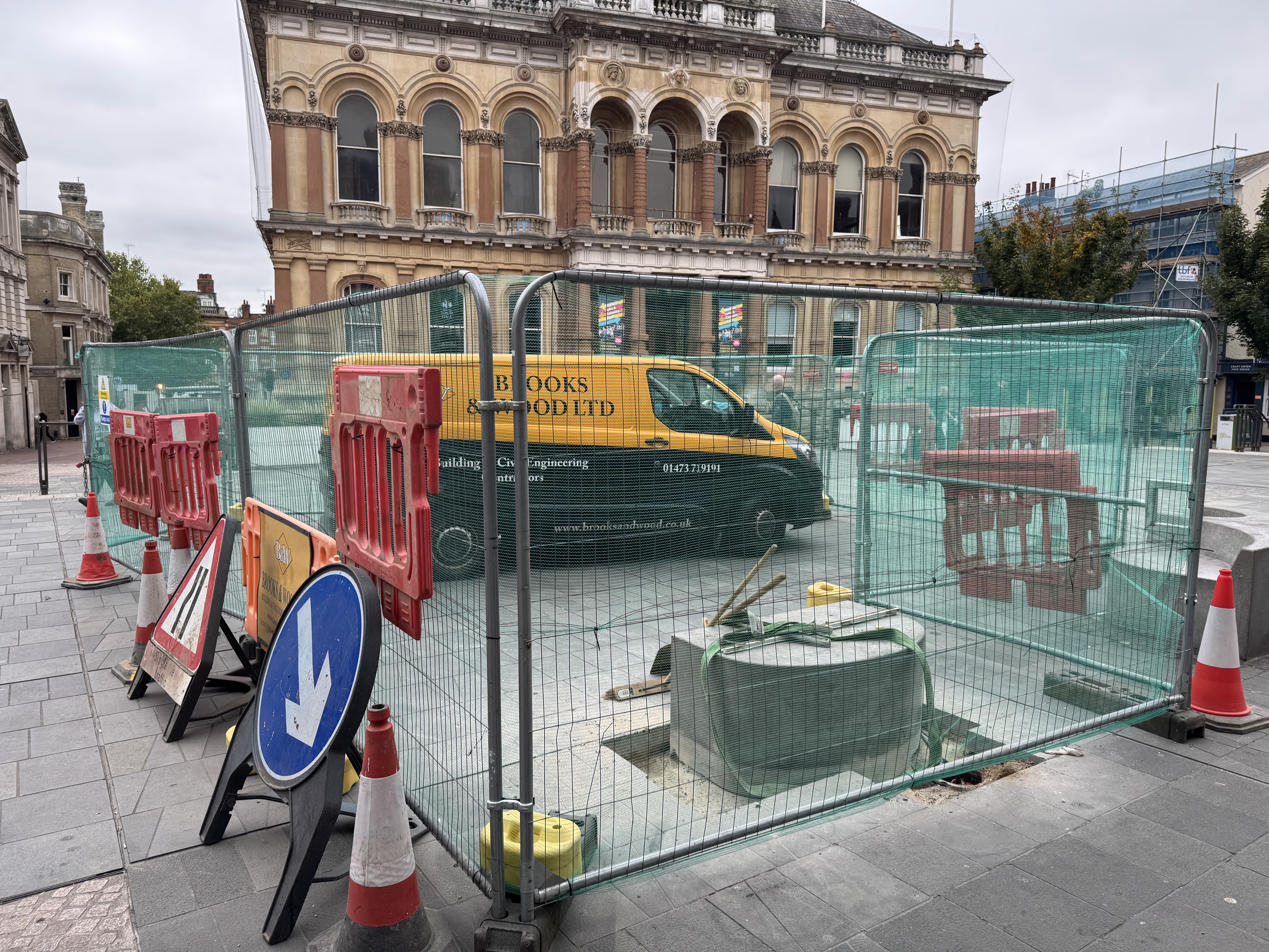 A bench being removed in preparation for the installation of the digital portal