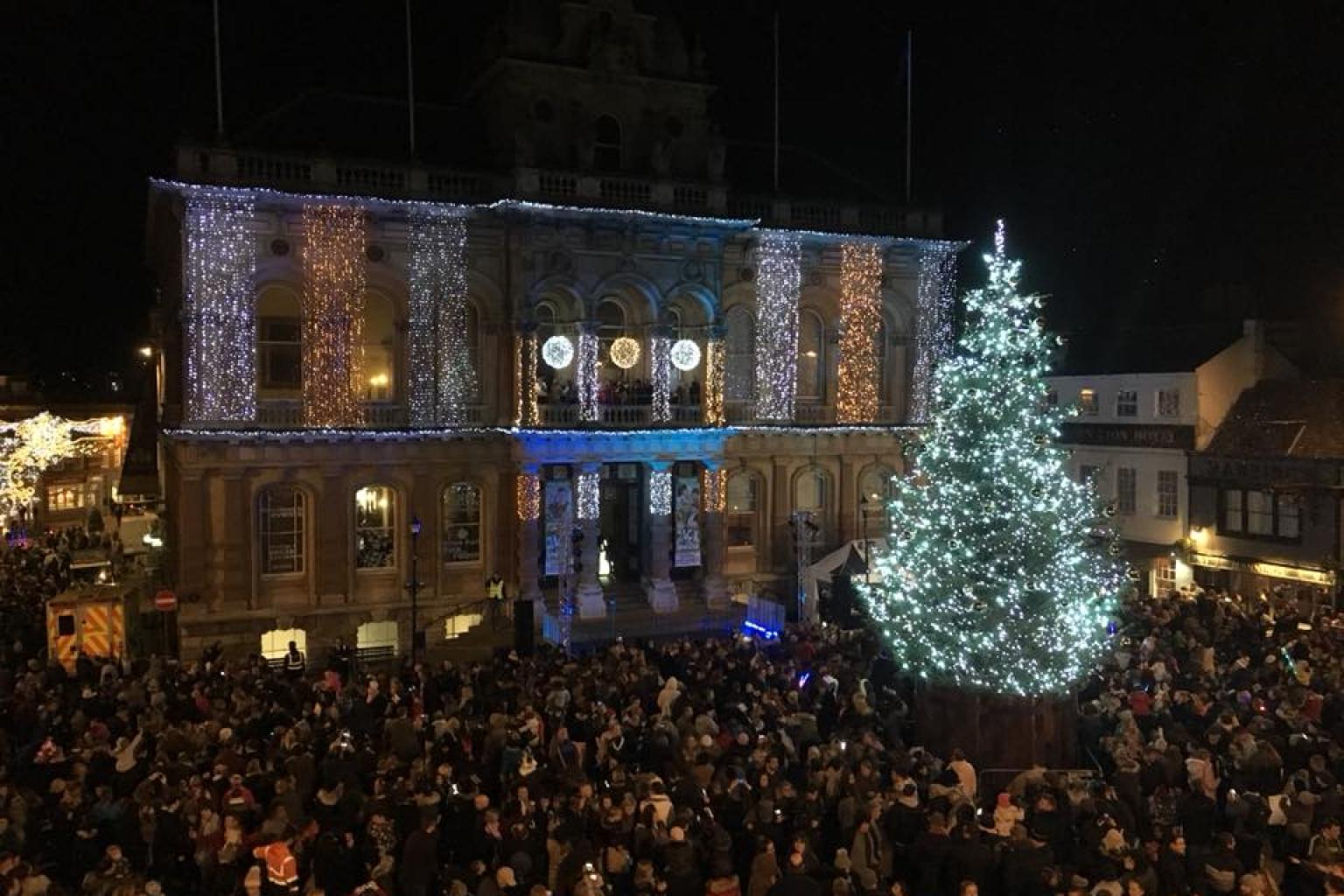Christmas tree and crowd of people