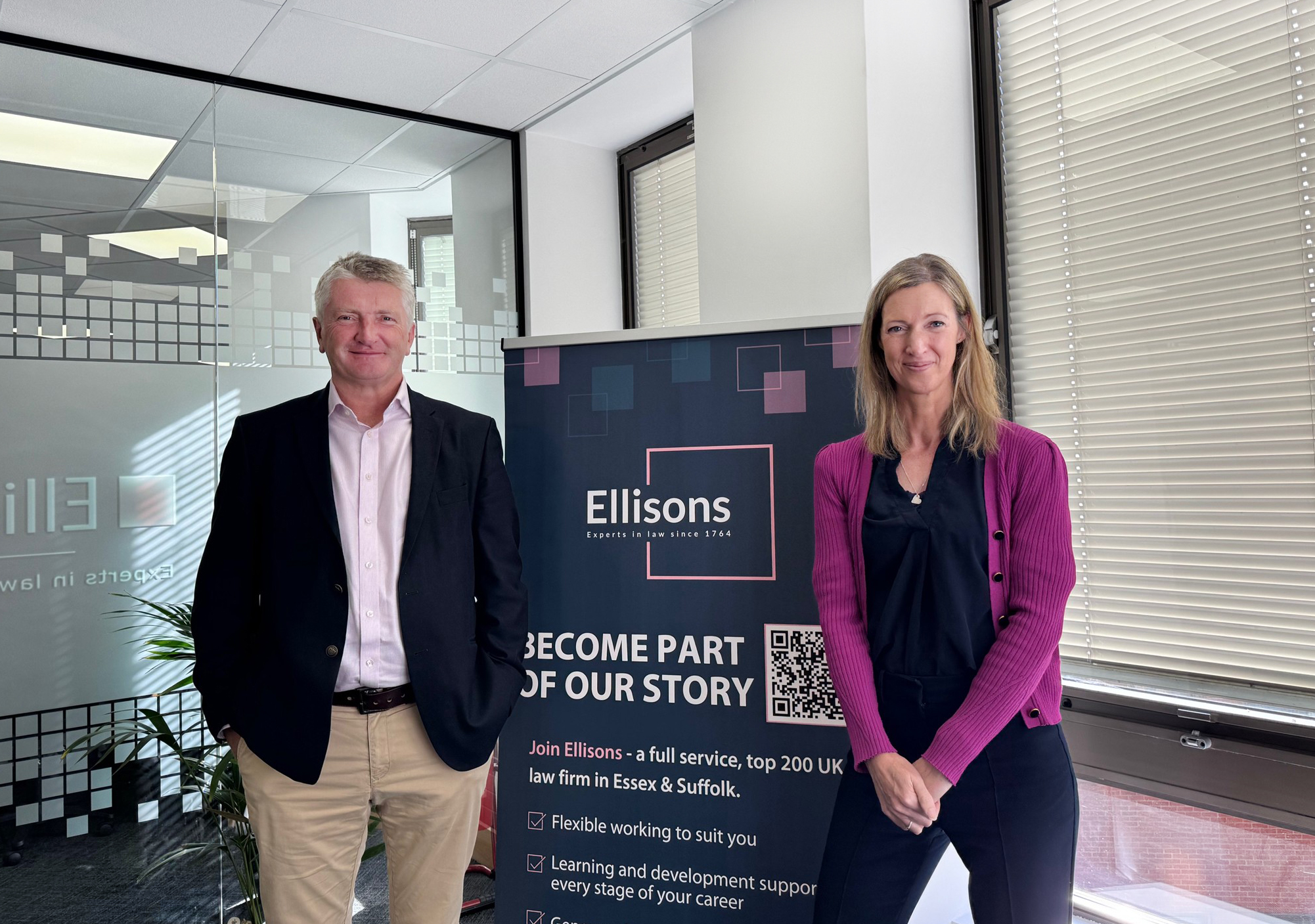 Two people in office room