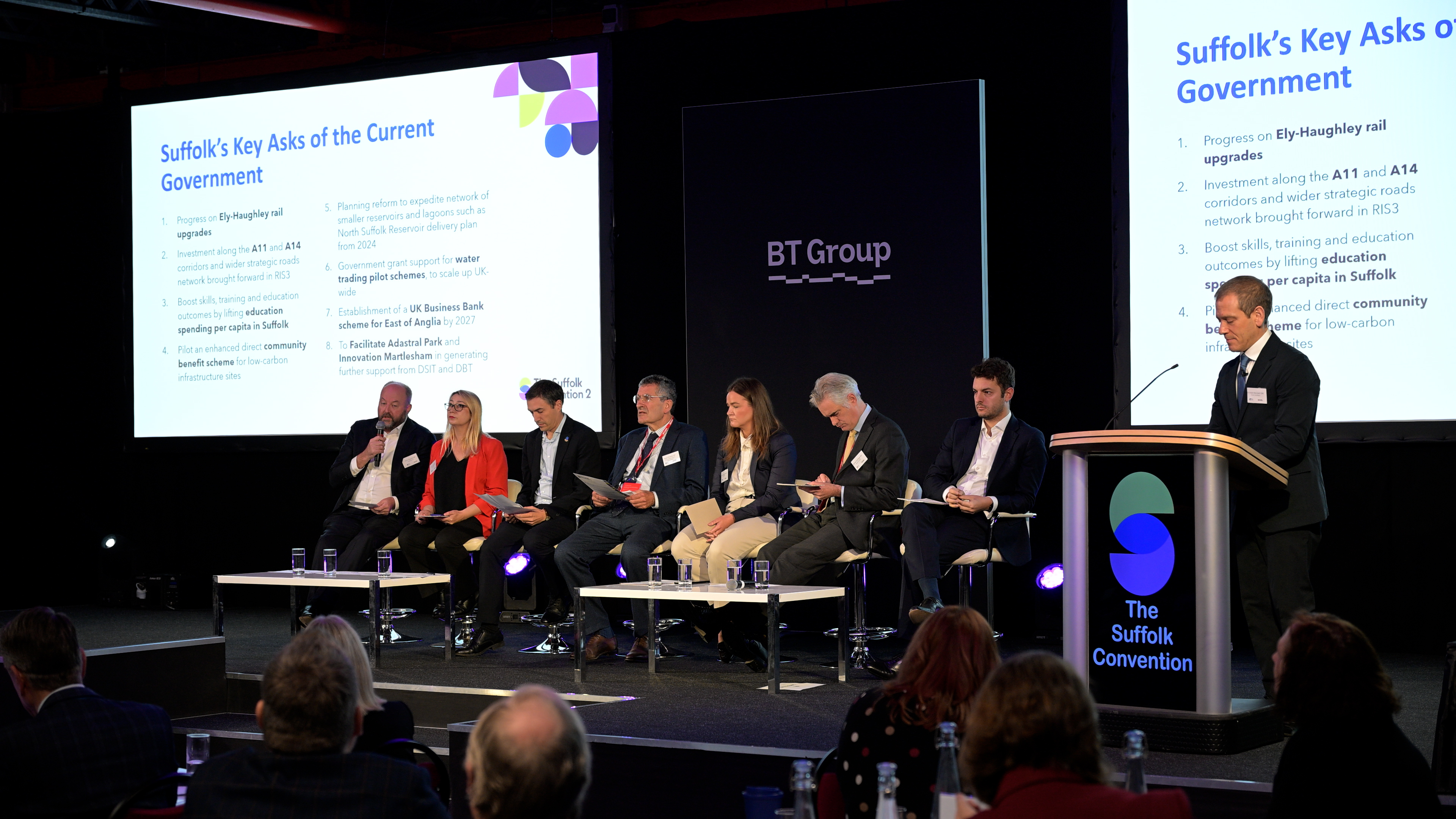 People sat on stage in a room