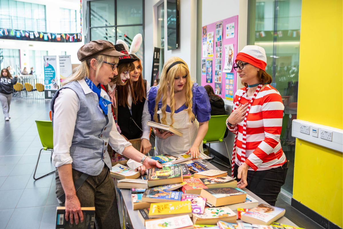 Book swap stall in the atrium at Suffolk New College for World Book Day