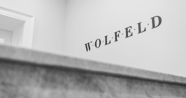 Wolfeld logo on wall