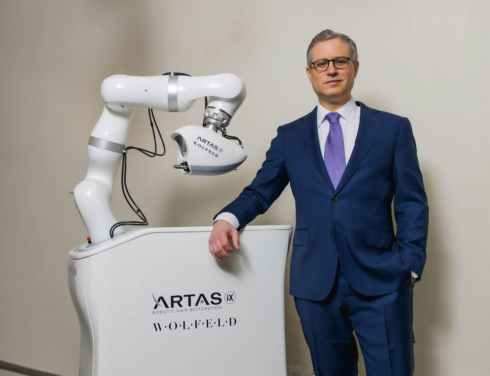 Dr. Wolfeld near the artas machine