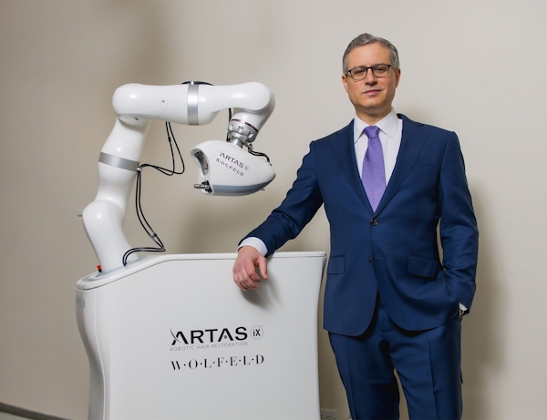 Dr. Wolfeld near the artas machine
