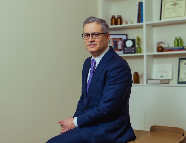 Dr. Wolfeld sitting on a table
