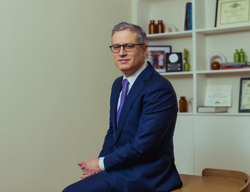 Dr. Wolfeld sitting on a table