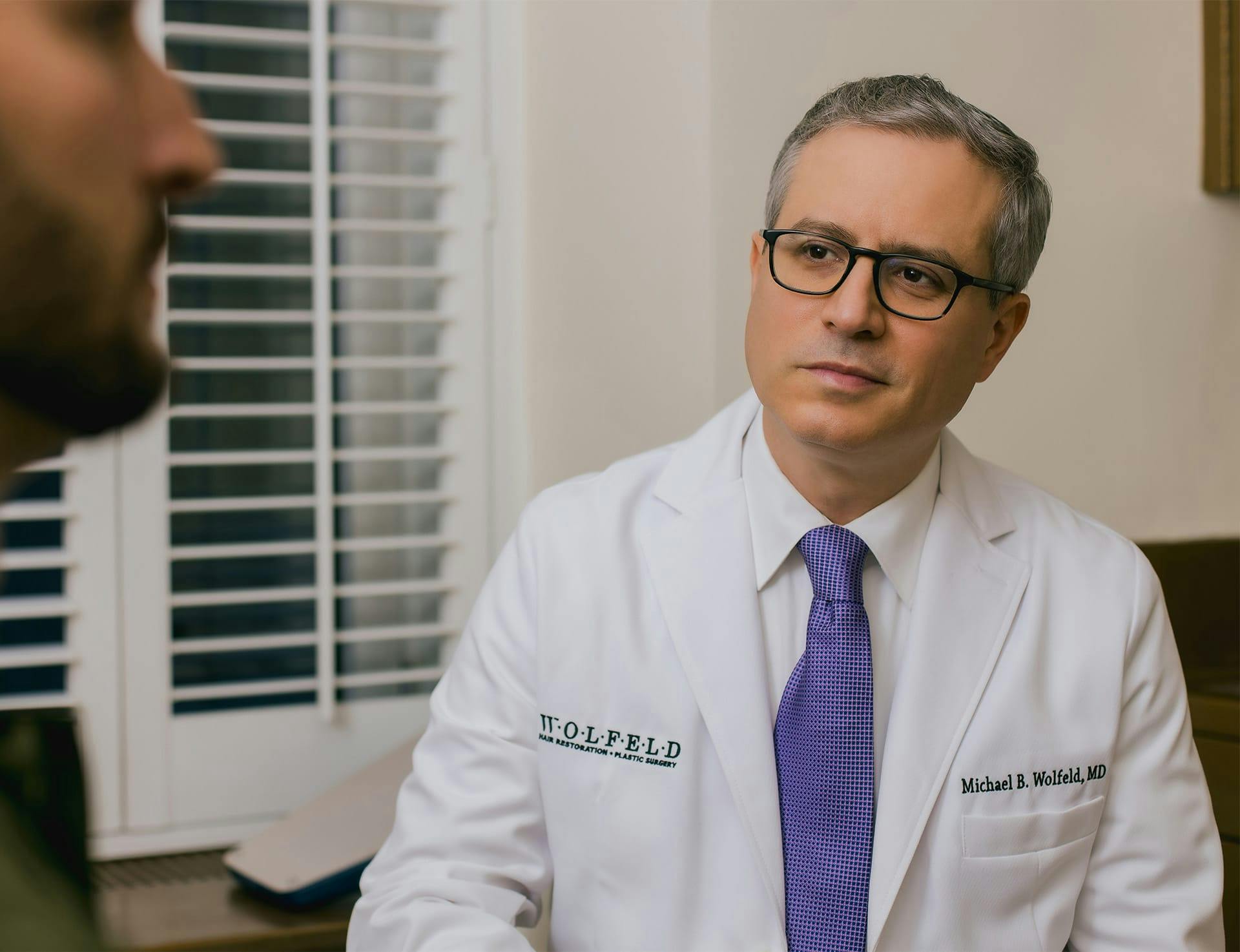 Dr. Wolfeld and patient during consultation