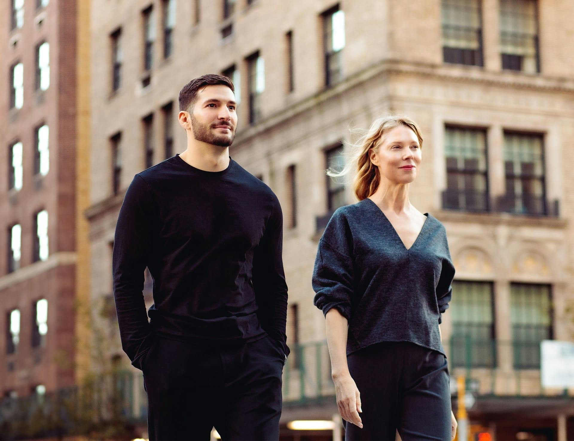 man and woman smiling outside