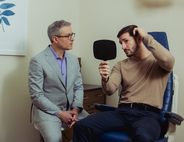 Dr. Wolfeld and patient during consultation