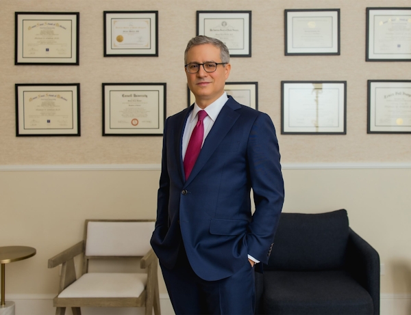 Dr. Wolfeld in front of accomplishments