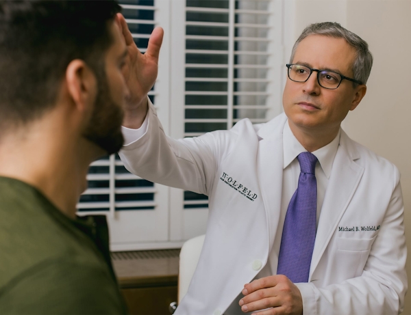 Dr. Wolfeld and patient during consultation