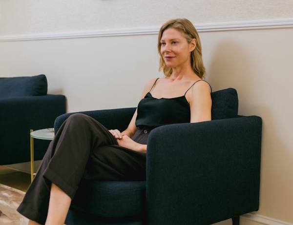 woman in waiting room smiling