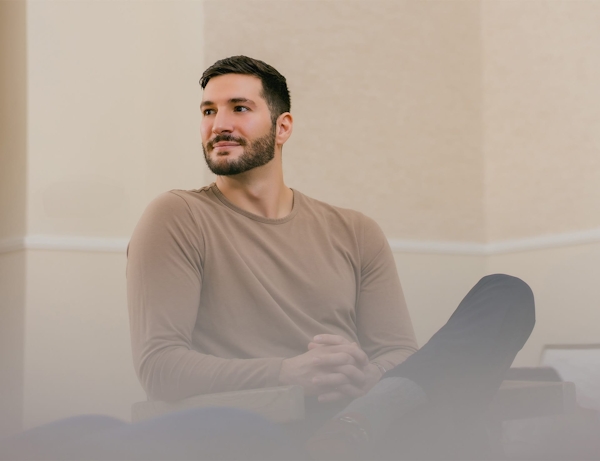 man sitting in waiting room smiling