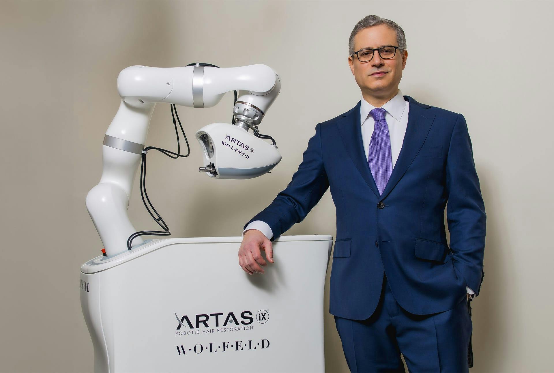 Dr. Wolfeld near the artas machine