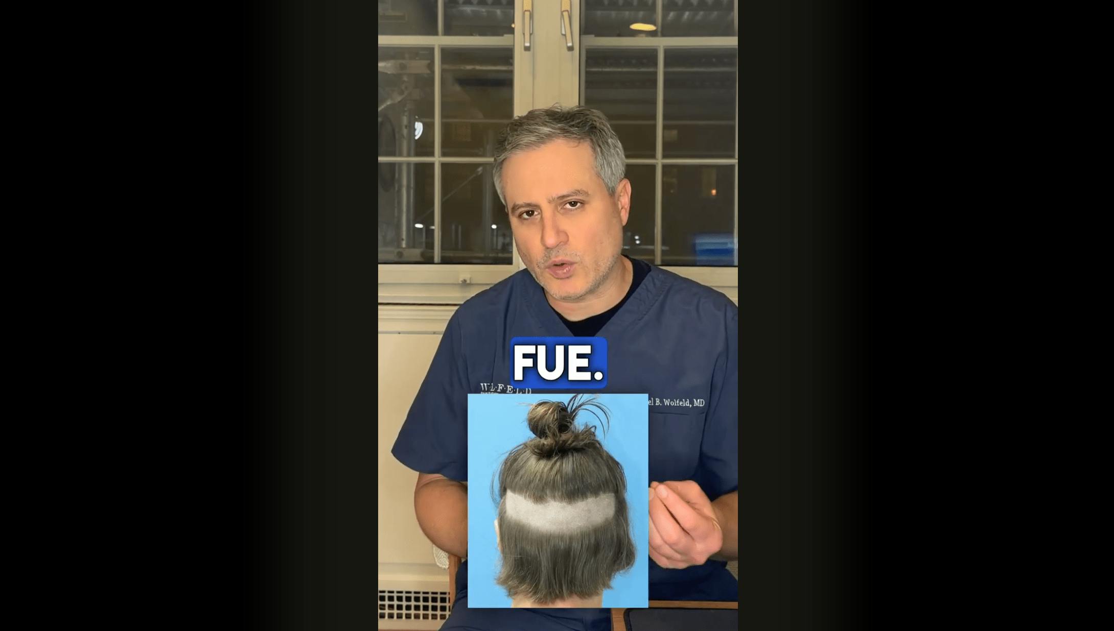 doctor showing FUE patient photo