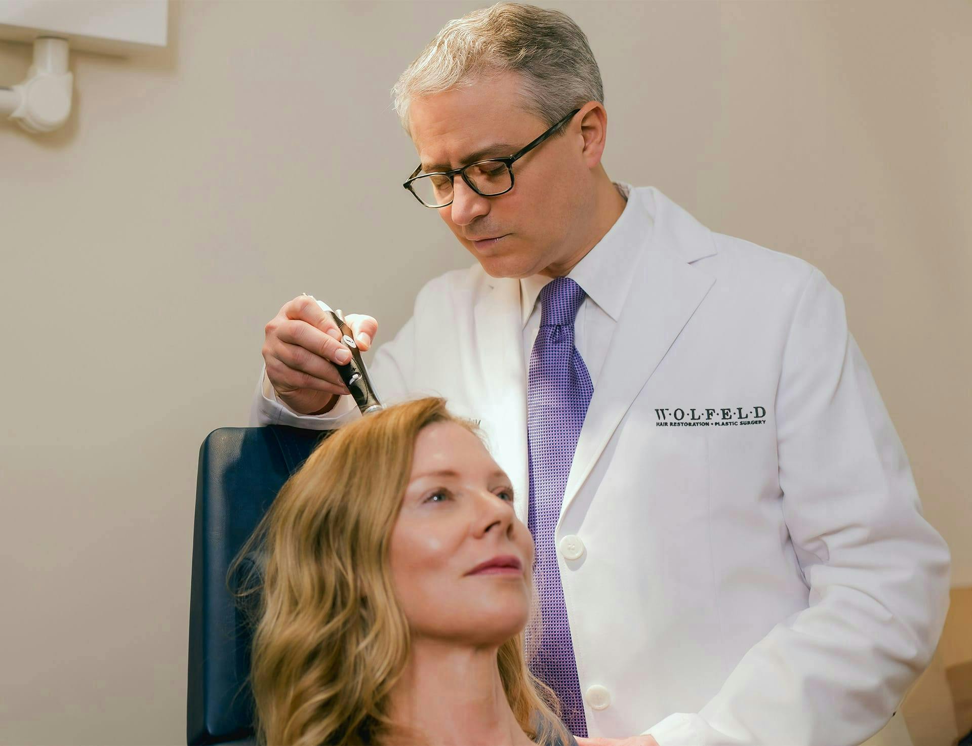 Dr. Wolfeld with a female patient