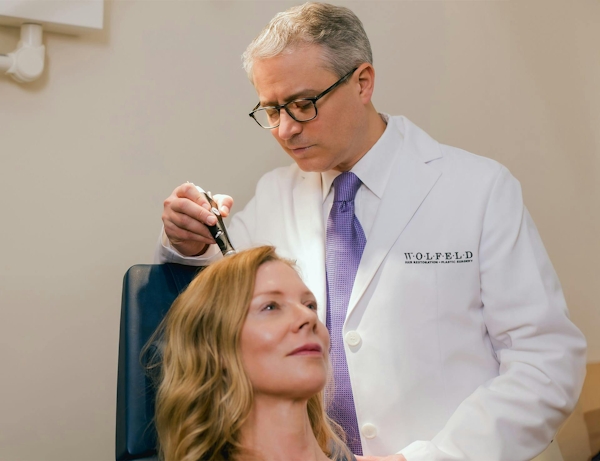 Dr. Wolfeld with a female patient
