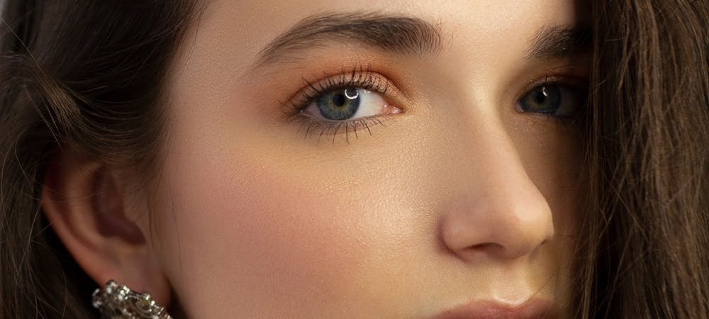 Strategic incision placement in lower blepharoplasty minimizes visible scarring, using techniques like transconjunctival or subciliary incisions for a natural look.