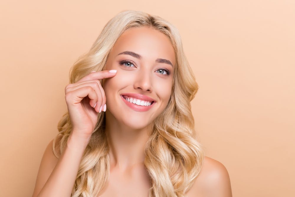 woman with long blonde hair smiling