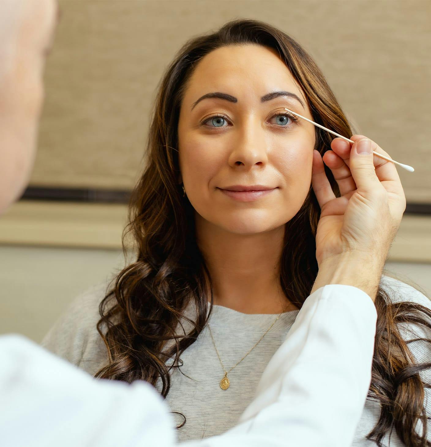 Doctor touching a patients face