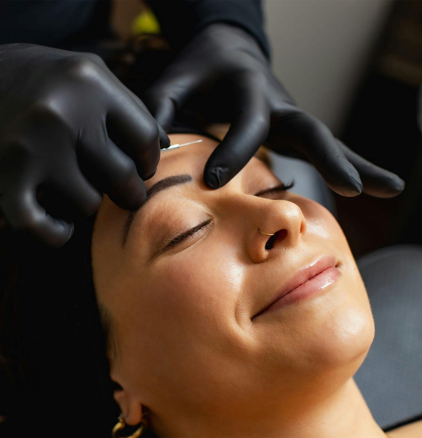 woman receiving dermaplaning