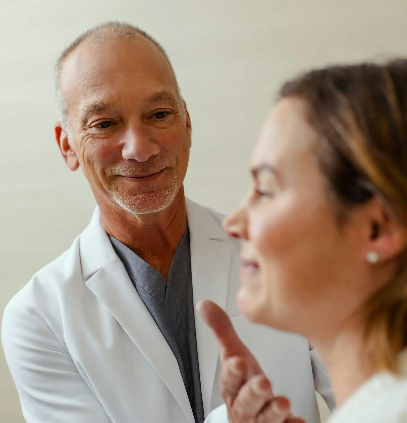 doctor reaching to a patient's chin
