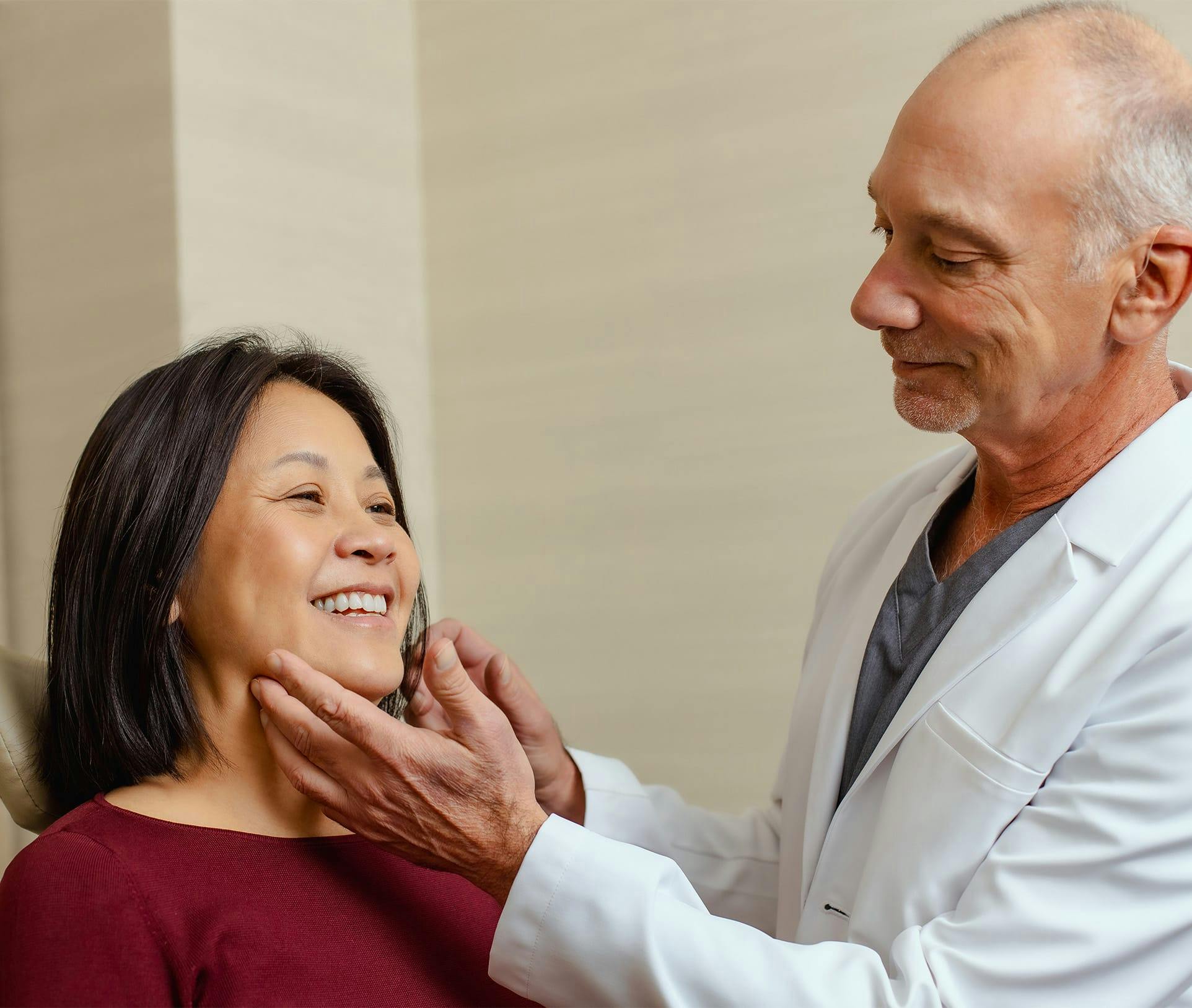 doctor touching patient's face