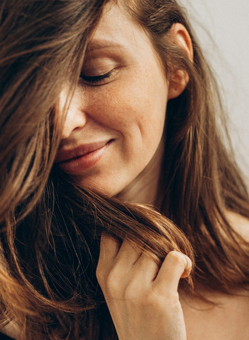 black and white photo of a woman sitting on the ground