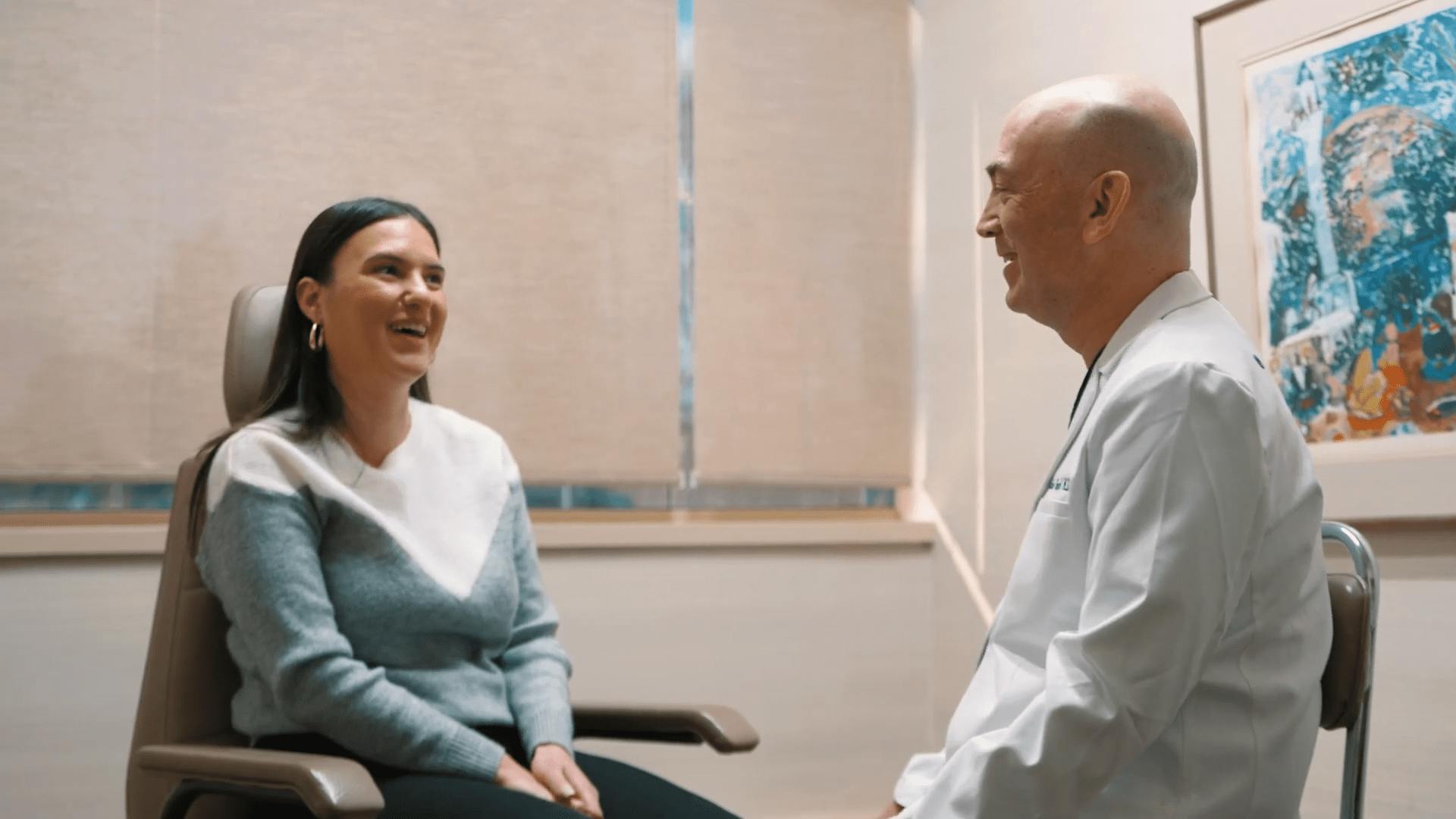 Doctor and patient sitting and looking at eachother