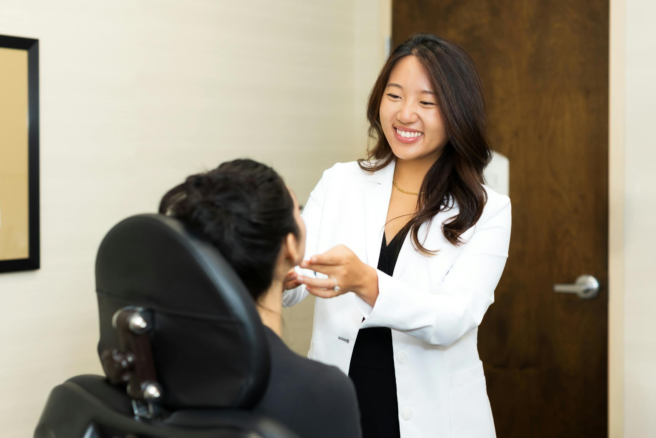 Dr. Clara Lee speaking with a woman