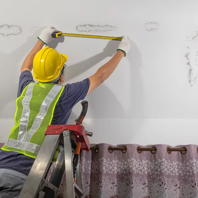 contractor assessing leaking ceiling