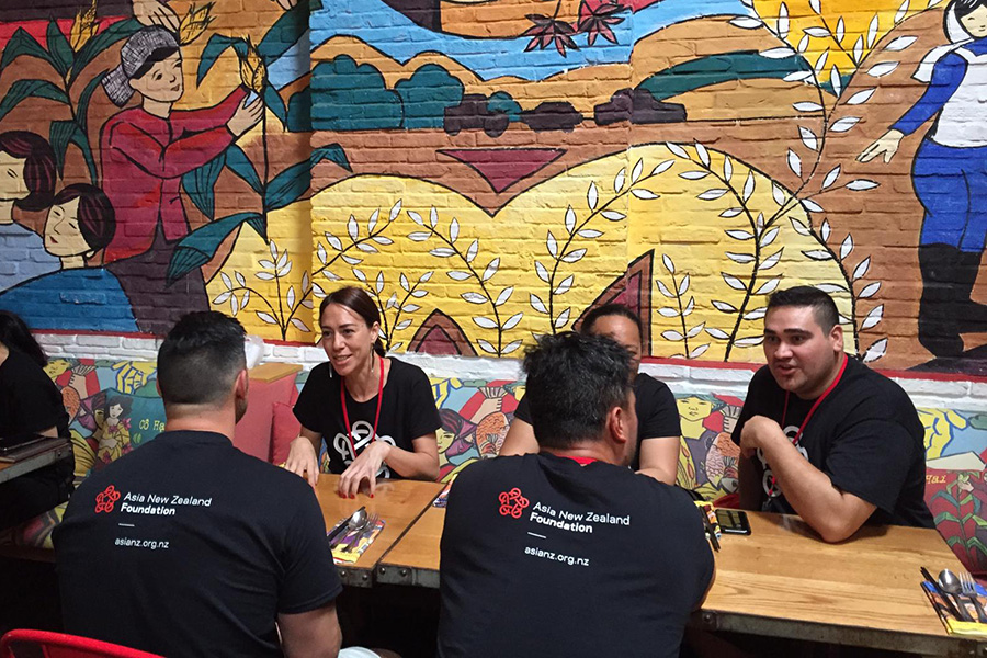 The entrepreneurs chatting round a restaurant table