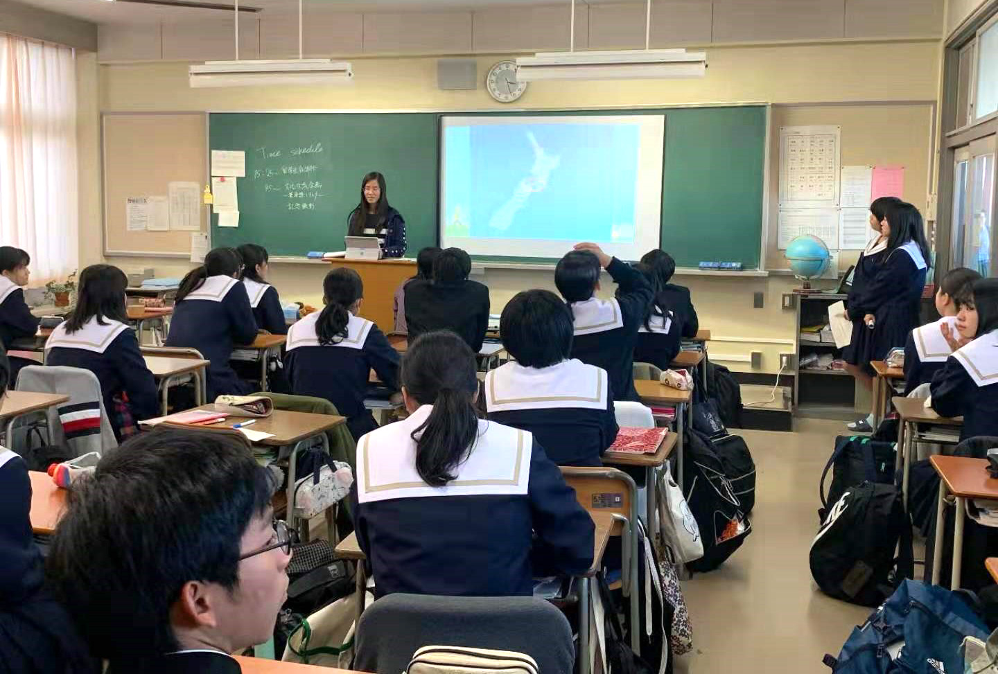 Yalu talking to a class of high school students