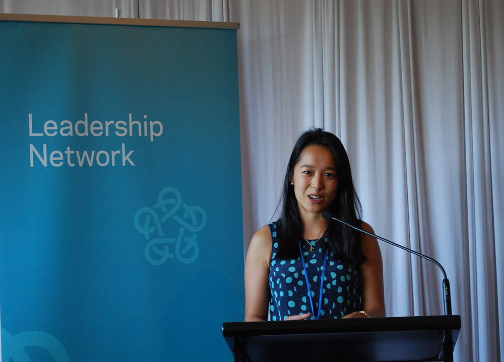 Alice Wang speaking from a podium
