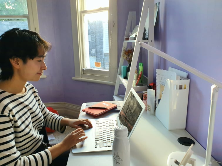Karen working at her laptop