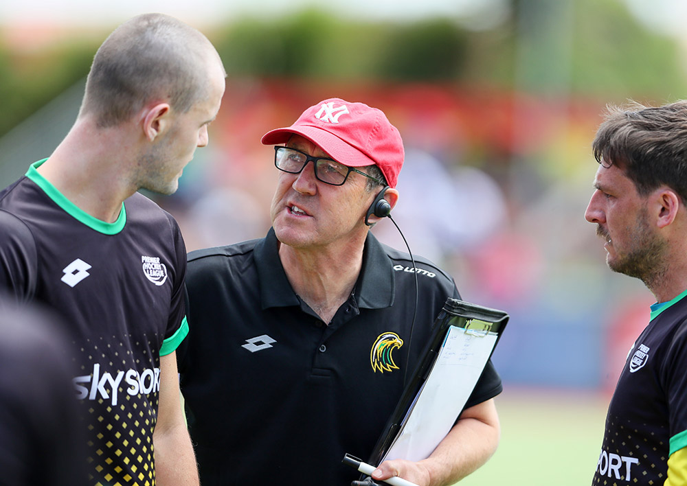 Miskimmin providing coaching advice to a hockey player