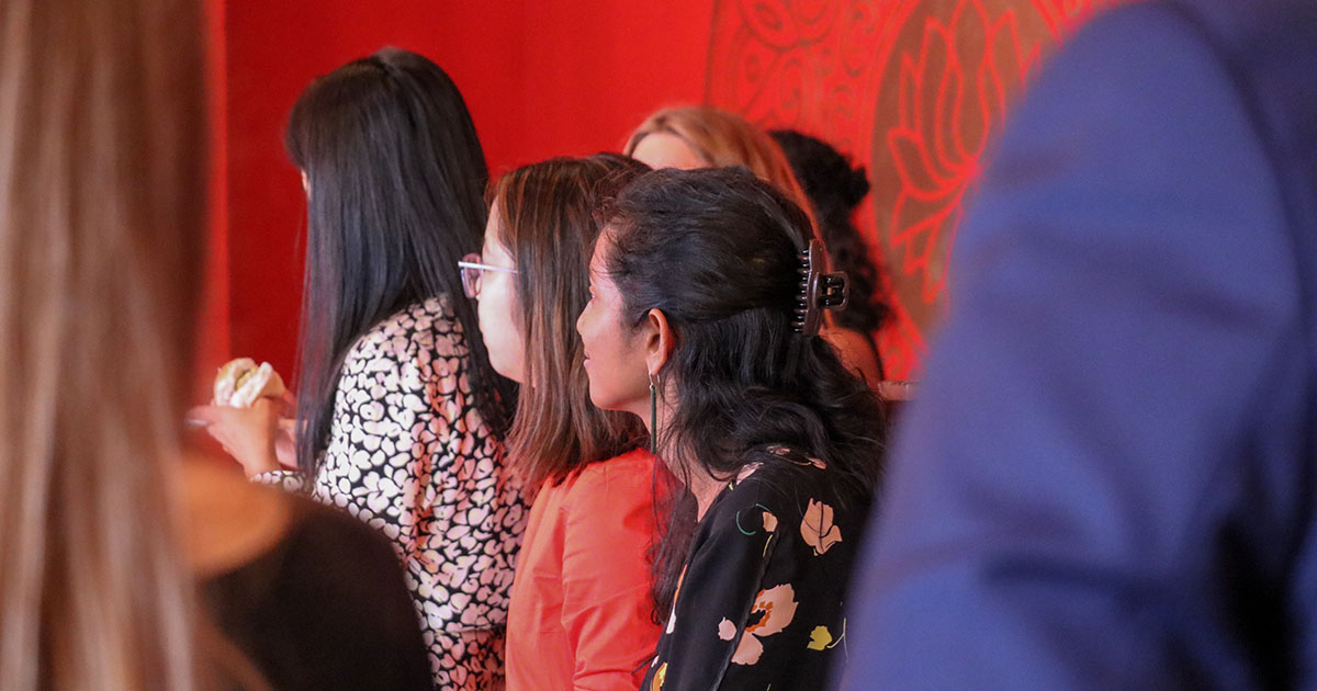 Three Leadership Network members listen to graduating member Jack Sheppard as he reflects on his journey within the Network