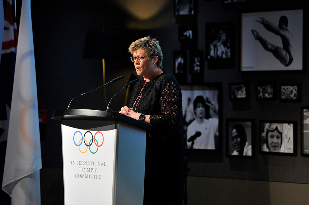 Kereyn talking to an audience from a dias