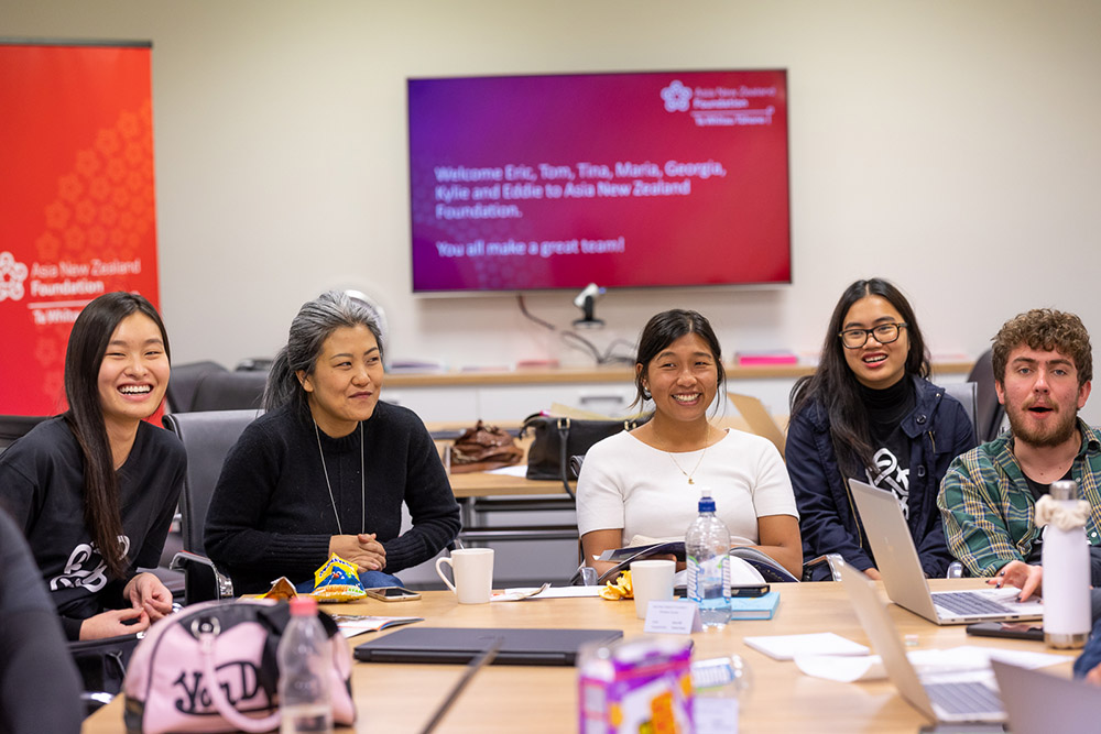 members of the Foundation team sitting at a table in the Foundation's office in Wellington