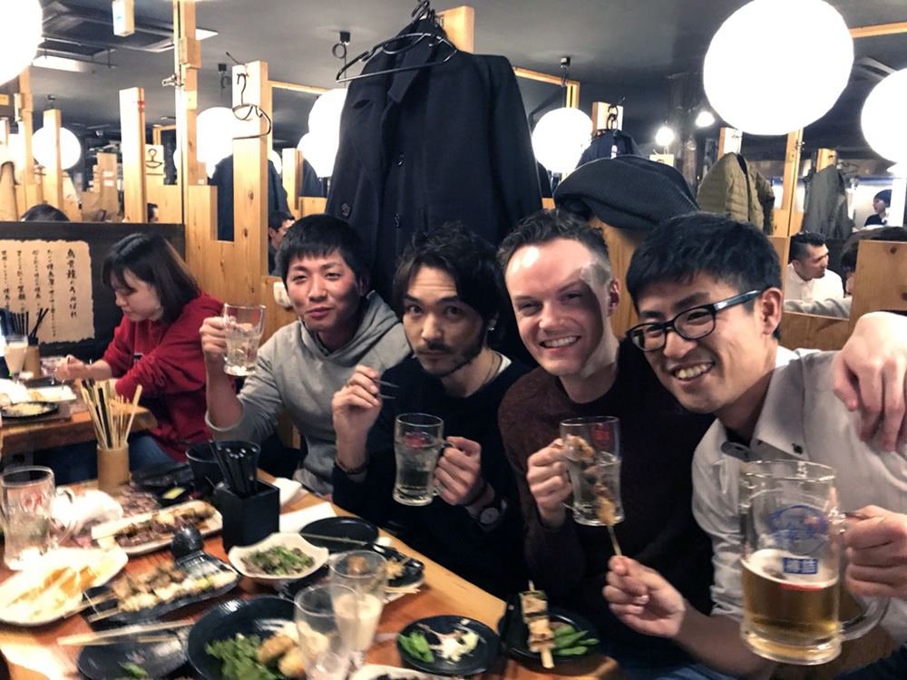 Marcus in a restaurant with colleagues from his Japanese school