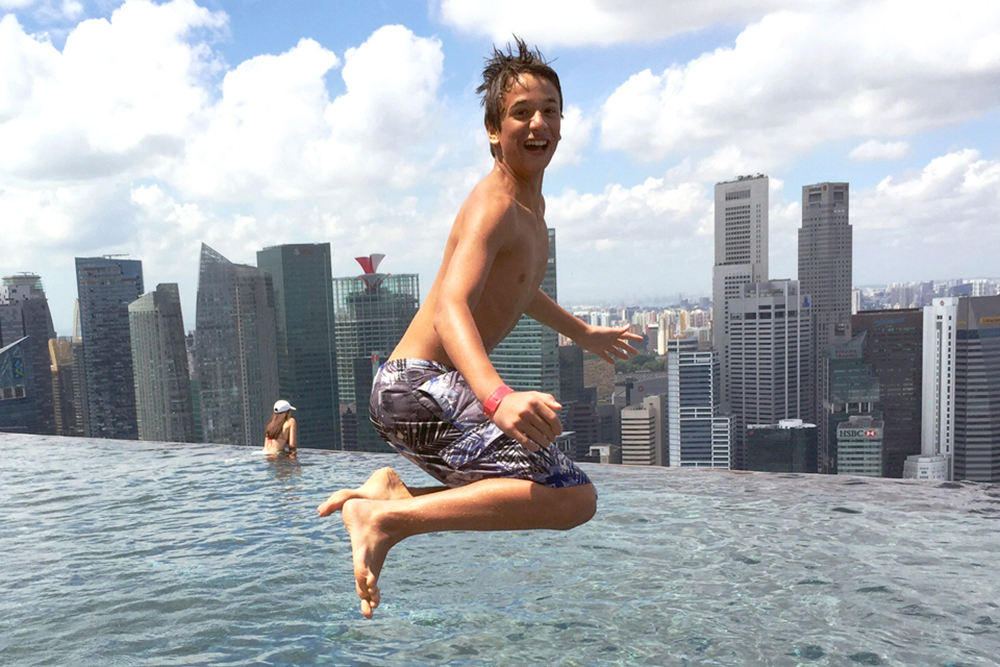 Tourist jumping in pool singapore story 1