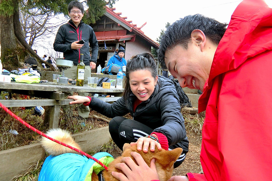 Charlene and a friend patting a dog