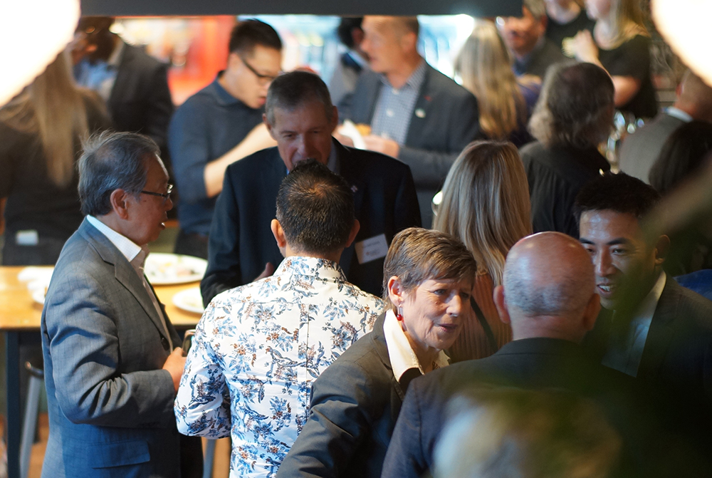 A gathering of people chatting at the opening of the Foundation's Christchurch office