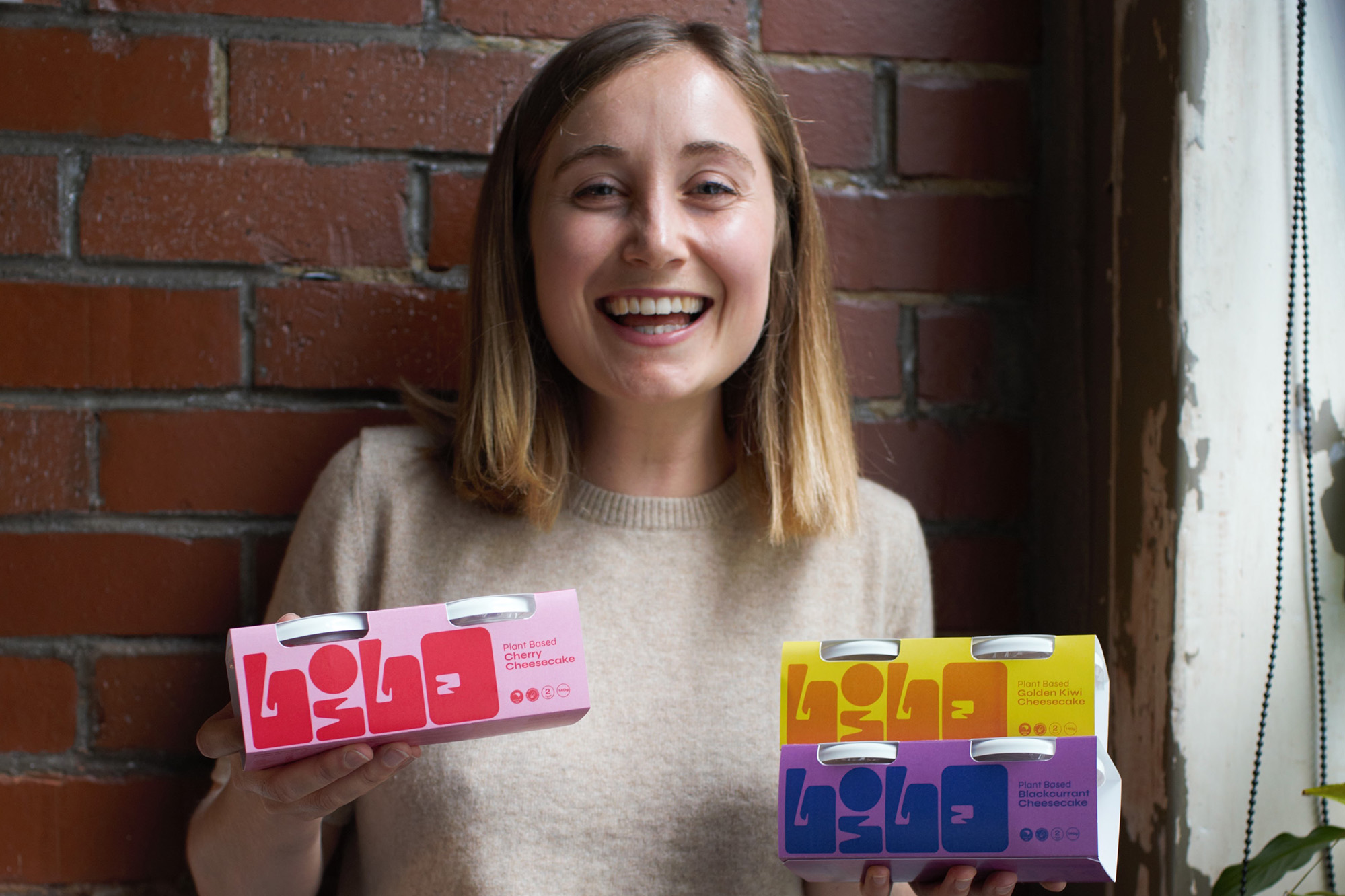Cleo holding packs of her dessert Lilo