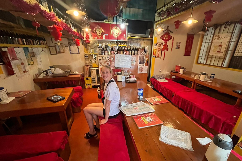 A girl sitting in a bar/restaurant