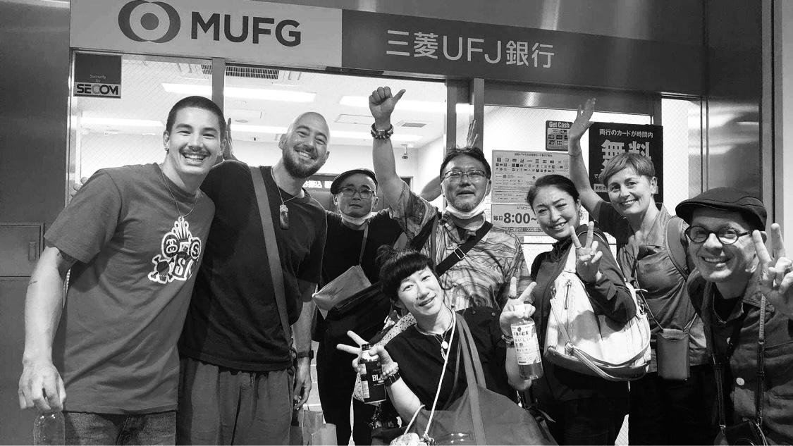 Daniel posing for a photo with his wife and the Dragon film team