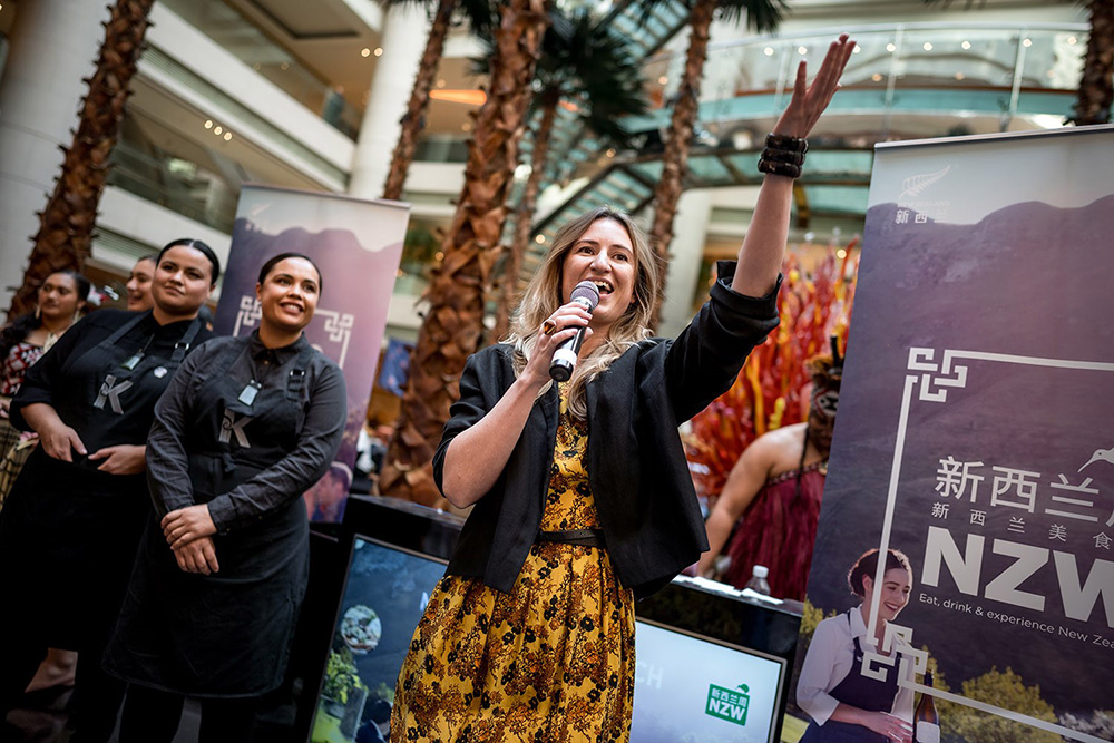 Eleni speaking to an audience at New Zealand Week